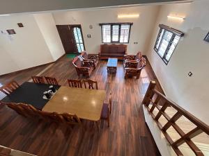 an overhead view of a living room with a table and chairs at Hari's Haven in Kodaikānāl