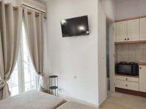 TV a/nebo společenská místnost v ubytování Happiness Apartment 6