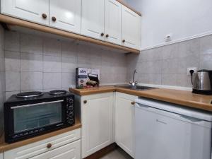 Kuchyň nebo kuchyňský kout v ubytování Happiness Apartment 6