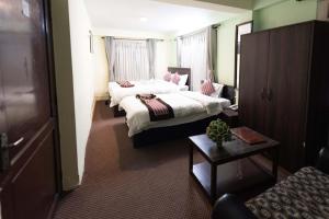 Postel nebo postele na pokoji v ubytování Yeti Cozy Hotel + 36 fotografií