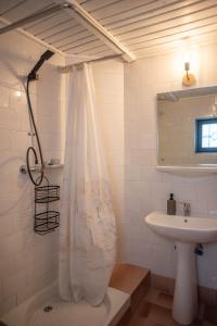 a bathroom with a shower curtain and a sink at Villa Sara in Sinaia near Peles & Gondola in Sinaia +58 photos