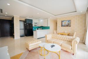 a living room with a couch and a table at D'capitale - Feria Homes in Hanoi