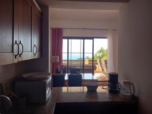 a kitchen with a view of a living room at Townhouse Altea Hills in Altea