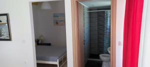 a bathroom with a sink and a toilet in a room at Chania City Apartments in Chania +26 photos
