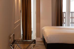 Postel nebo postele na pokoji v ubytování Midtown Hotel triple