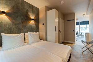 Postel nebo postele na pokoji v ubytování Midtown Hotel triple