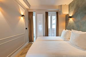 Postel nebo postele na pokoji v ubytování Midtown Hotel triple