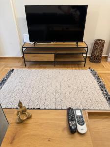 A television and/or entertainment centre at 1 BedRoom Apt - Live Like A Local In Kolonaki