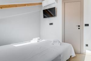 Posteľ alebo postele v izbe v ubytovaní Tiny Secret House