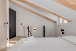Posteľ alebo postele v izbe v ubytovaní Tiny Secret House