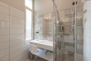 Koupelna v ubytování Hotel Villa Levi + 37 fotografií