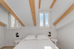 Posteľ alebo postele v izbe v ubytovaní Tiny Secret House