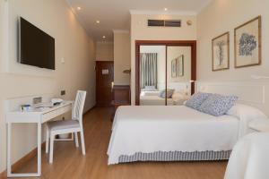Postel nebo postele na pokoji v ubytování VIK Hotel San Antonio
