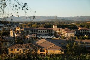 a city with buildings and mountains in the background at The Meritage Resort and Spa in Napa