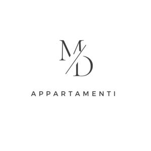 a logo with the letter m and letter km intertwined at M&D Appartamenti in Trapani