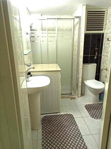 a bathroom with a sink and a toilet at NEXT TO CAFES, BEACH AND ALL AMENITIES in Antalya