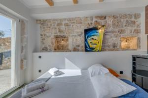 Posteľ alebo postele v izbe v ubytovaní Tiny Secret House