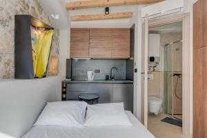 Posteľ alebo postele v izbe v ubytovaní Tiny Secret House