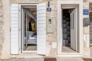 Posteľ alebo postele v izbe v ubytovaní Tiny Secret House