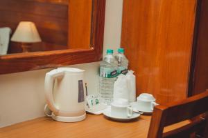 a coffee maker and bottles of water on a table at Mount View Pokhara in Pokhara