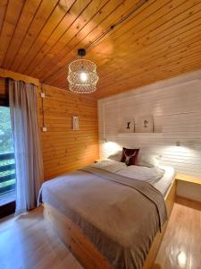 Postel nebo postele na pokoji v ubytování Forest Apartments Pokljuka