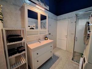 a bathroom with a sink and a shower at ViaGiotto Guest House in Certaldo +31 photos