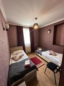 A bed or beds in a room at Guest house chavchavadze N23