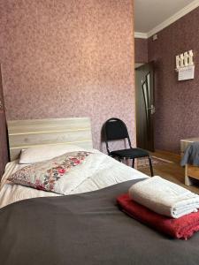 A bed or beds in a room at Guest house chavchavadze N23