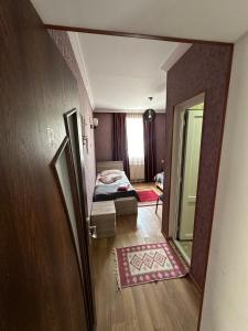 A bed or beds in a room at Guest house chavchavadze N23