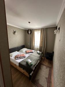 A bed or beds in a room at Guest house chavchavadze N23