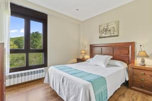 Un pat sau paturi într-o cameră la Trigalin