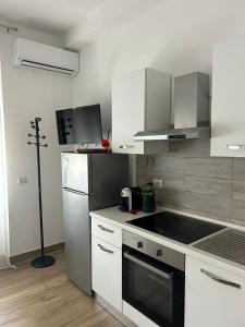 A kitchen or kitchenette at BeB via Sardegna