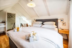 a bedroom with two large beds with white sheets at Villa Mista in Sutivan +39 photos