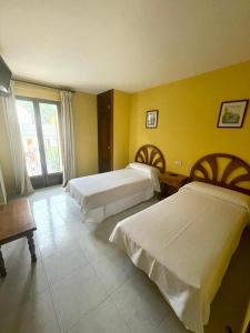 Postel nebo postele na pokoji v ubytování Hostal Rural Sositana