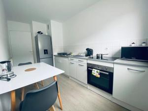 Η κουζίνα ή μικρή κουζίνα στο 3 pièces à 63 m² avec parking gratuit