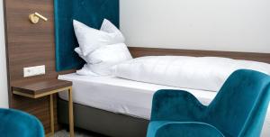 Letto o letti in una camera di Hotel am Prinzengarten, inklusive AlbCard