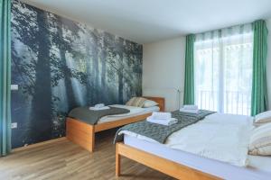 Postel nebo postele na pokoji v ubytování Hotel Jelka Pokljuka