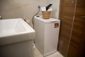 a bathroom with a toilet with a basket on top of it at Paradise Valley in Rvaši +34 photos