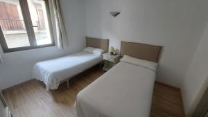 Postel nebo postele na pokoji v ubytování Hostal Rural Sositana