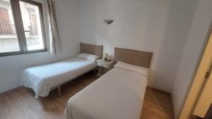 Postel nebo postele na pokoji v ubytování Hostal Rural Sositana