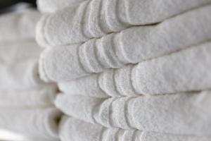 a pile of white towels stacked on top of each other at Melt in Palanga in Palanga