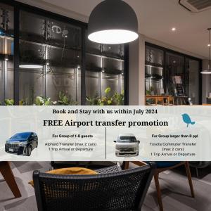 a sign for a free airport transfer promotion for a car at humble abode - vacation home in Bangkok