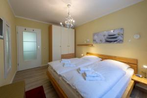 Ein Bett oder Betten in einem Zimmer der Unterkunft Wohnpark Stadt Hamburg - Apt. 14