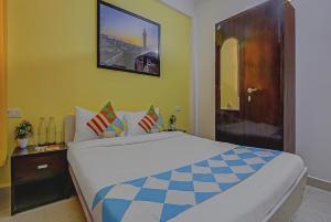 a bedroom with a large bed in a room at Saket Residency KD Plaza - 6 in New Delhi