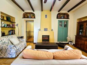 a living room with a couch and a fireplace at A Casa del Farmacista in Casarano +80 photos