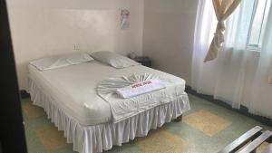 מיטה או מיטות בחדר ב-HOSTAL YAPURA
