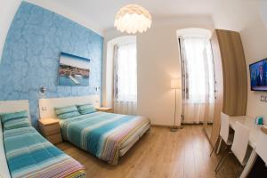 Postel nebo postele na pokoji v ubytování Rooms Boutique Carducci