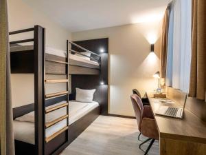 Кровать или кровати в номере Mercure Oostende