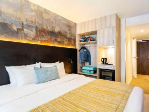 Кровать или кровати в номере Mercure Oostende