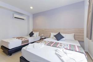 Postel nebo postele na pokoji v ubytování M HOTEL - Medan Tuanku Near MARA